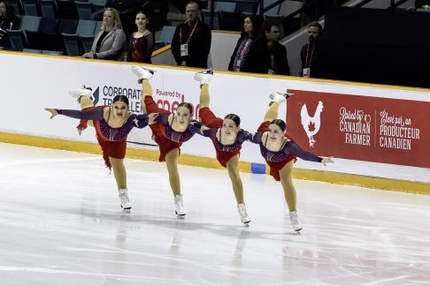 Four Figure Skaters in Red