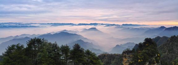 Clouds and mist cover the mountains