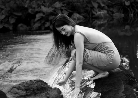 Playing by the water stream