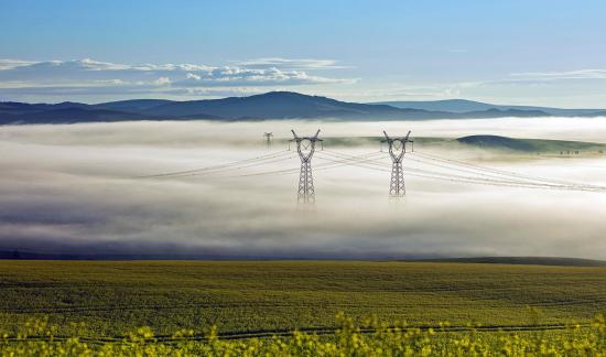 Clouds and mist cover the grassland