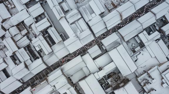 Snow covered empty alley