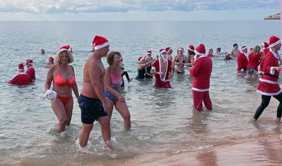 Santa Clauses are swimming 6