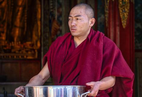 Man holding empty rice bowl