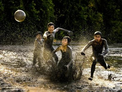 Playing ball in mud